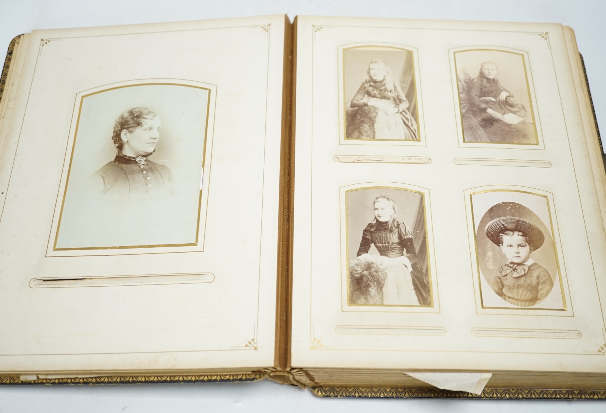 An album of Victorian sketches, photographs, scraps and prints and a leather photograph album, photograph album 29.5cm high. Condition - fair to good